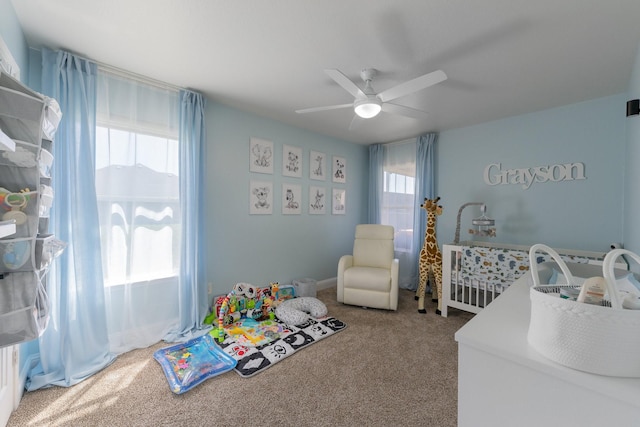 306 Hardeman Blvd, Justin, TX 76247 - carpeted bedroom with multiple windows and ceiling fan