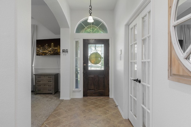 306 Hardeman Blvd, Justin, TX 76247 - tiled entrance foyer with arched walkways and carpet floors