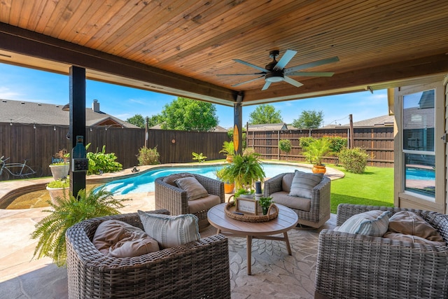 306 Hardeman Blvd, Justin, TX 76247 - fenced backyard with ceiling fan, a patio area, and an outdoor living space