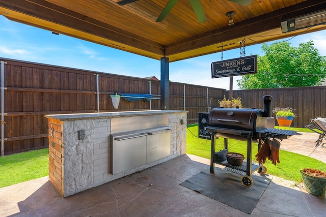306 Hardeman Blvd, Justin, TX 76247 - fenced backyard with ceiling fan and a patio area