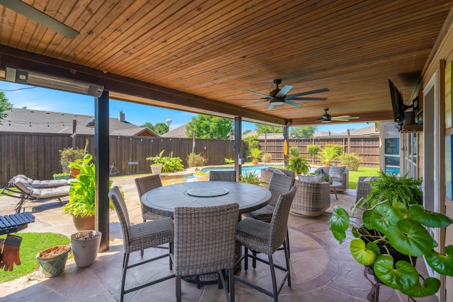 306 Hardeman Blvd, Justin, TX 76247 - fenced backyard with a patio, outdoor dining space, and ceiling fan