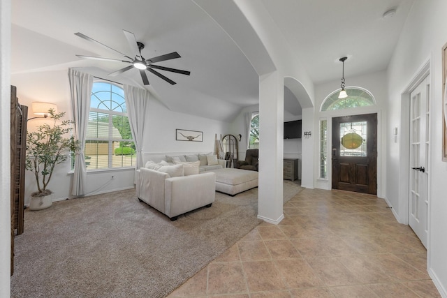 306 Hardeman Blvd, Justin, TX 76247 - entryway with arched walkways, ceiling fan, plenty of natural light, baseboards, and lofted ceiling