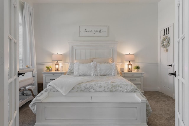 306 Hardeman Blvd, Justin, TX 76247 - bedroom featuring dark carpet and baseboards