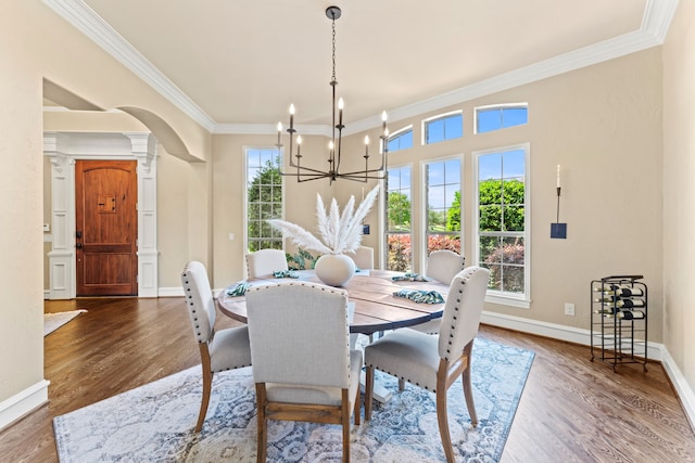 406 Wyndemere Blvd, Heath, TX 75032 - dining area featuring decorative columns, ornamental molding, arched walkways, a chandelier, and baseboards