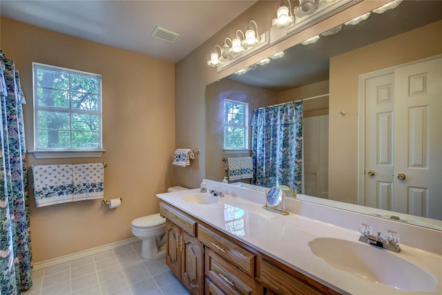 221 County Road 1946, Emory, TX 75440 - full bath with double vanity, toilet, a shower with shower curtain, baseboards, and tile patterned flooring