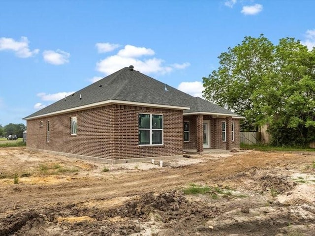 2799 Fm-3218, Commerce, TX 75428 - back of property featuring brick siding and a shingled roof