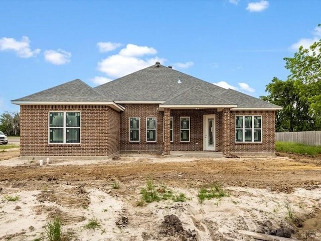 2799 Fm-3218, Commerce, TX 75428 - back of house featuring brick siding and a shingled roof