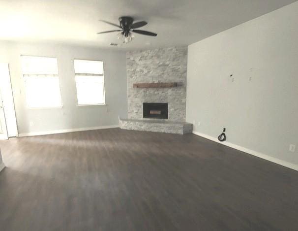 1207 Goldeneye, Aubrey, TX 76227 - unfurnished living room with a ceiling fan, wood finished floors, baseboards, and a fireplace