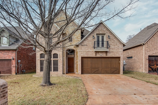 3317 S Riley Ct, Hurst, TX 76054 - view of front of home featuring a balcony, brick siding, a front yard, concrete driveway, and an attached garage