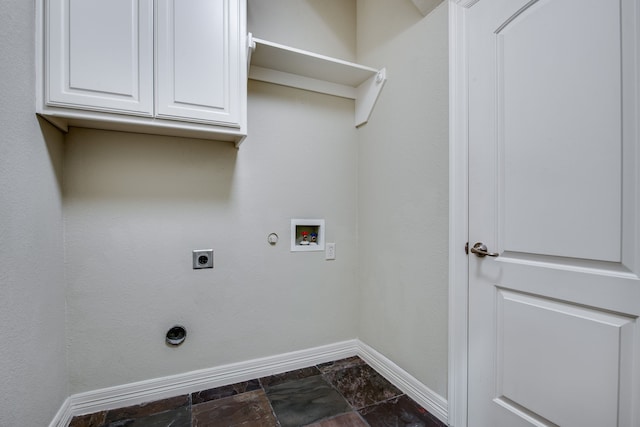 3317 S Riley Ct, Hurst, TX 76054 - laundry area with gas dryer hookup, baseboards, electric dryer hookup, washer hookup, and cabinet space