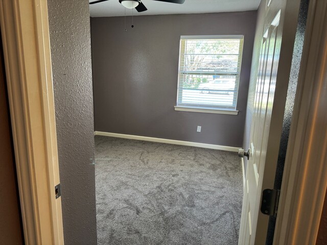 3422 Palm Dr, Mesquite, TX 75150 - unfurnished room featuring carpet floors, ceiling fan, baseboards, and a textured wall