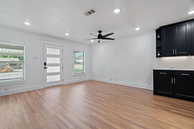 5316 Humbert Ave, Fort Worth, TX 76107 - unfurnished living room featuring crown molding, ceiling fan, light wood finished floors, baseboards, and recessed lighting