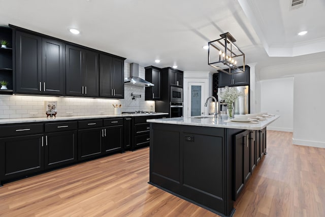 5316 Humbert Ave, Fort Worth, TX 76107 - kitchen featuring wall chimney range hood, dark cabinets, appliances with stainless steel finishes, open shelves, and a sink
