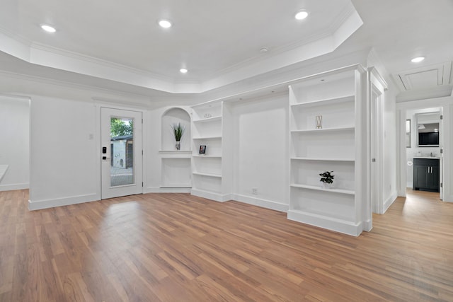 5316 Humbert Ave, Fort Worth, TX 76107 - unfurnished living room with light wood-style floors, a tray ceiling, built in features, crown molding, and baseboards