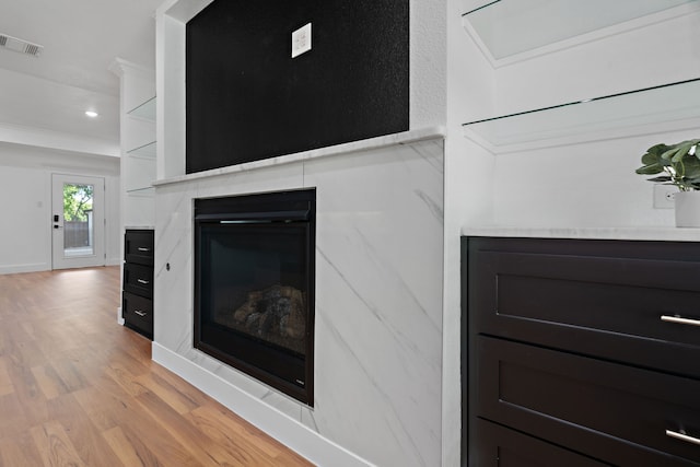 5316 Humbert Ave, Fort Worth, TX 76107 - detailed view of wood finished floors, recessed lighting, a glass covered fireplace, and baseboards