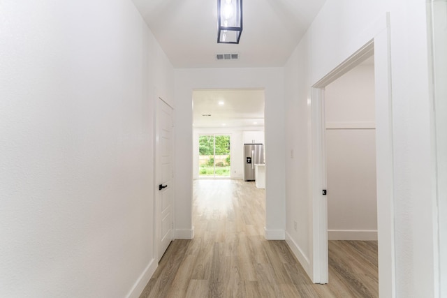 128 Goodman St, Sulphur Springs, TX 75482 - corridor featuring light wood-style flooring and baseboards