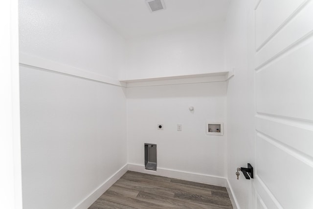 128 Goodman St, Sulphur Springs, TX 75482 - laundry area featuring hookup for an electric dryer, dark wood-style flooring, hookup for a washing machine, baseboards, and gas dryer hookup