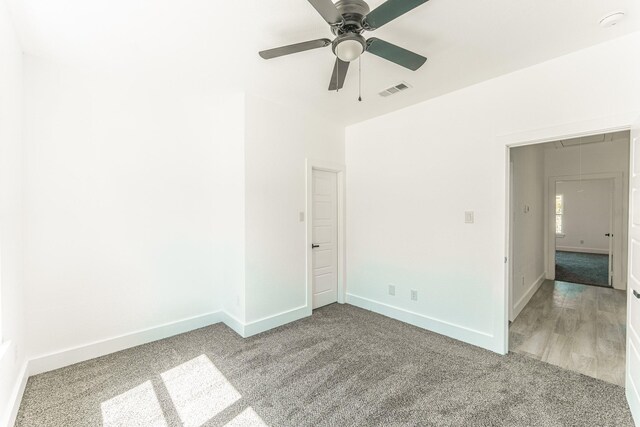 128 Goodman St, Sulphur Springs, TX 75482 - unfurnished room with light carpet, baseboards, a ceiling fan, and attic access