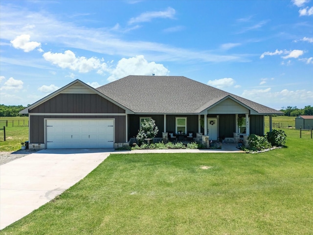 431 Advance Rd, Weatherford, TX 76088 - view of front of house featuring covered porch, an attached garage, driveway, a shingled roof, and board and batten siding