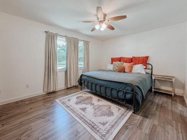 461 E Bradley St, Fairfield, TX 75840 - bedroom featuring wood finished floors, ceiling fan, and baseboards