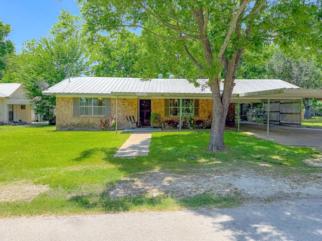 461 E Bradley St, Fairfield, TX 75840 - ranch-style house with a front yard and brick siding