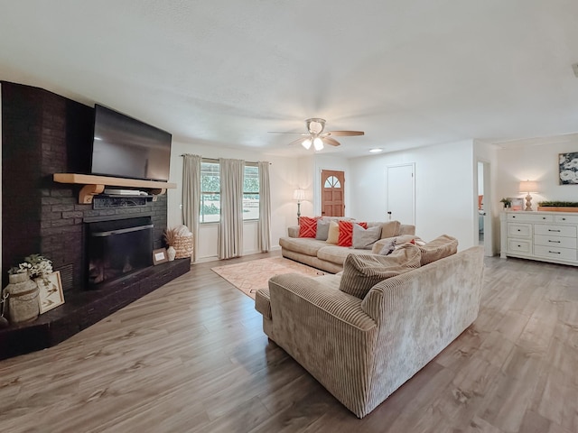 461 E Bradley St, Fairfield, TX 75840 - living room featuring ceiling fan, wood finished floors, and a brick fireplace