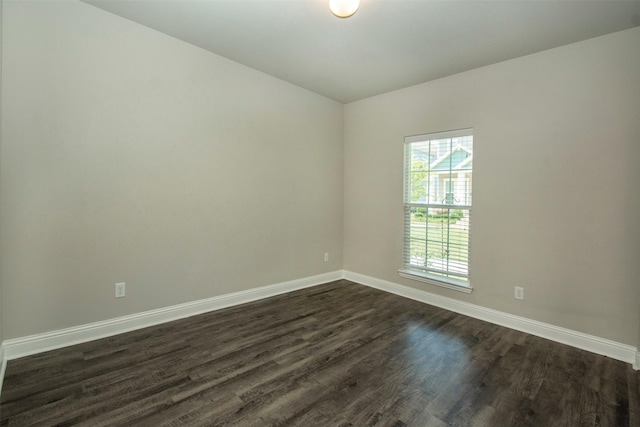 3613 Pisa Mews, Dallas, TX 75236 - spare room featuring dark wood-type flooring and baseboards