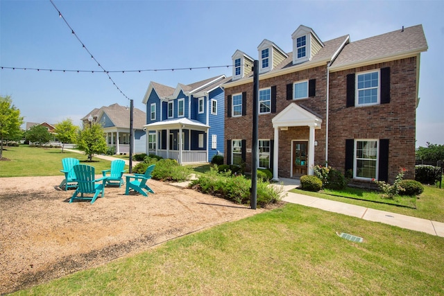 3613 Pisa Mews, Dallas, TX 75236 - view of front of home featuring a front yard, brick siding, and a residential view