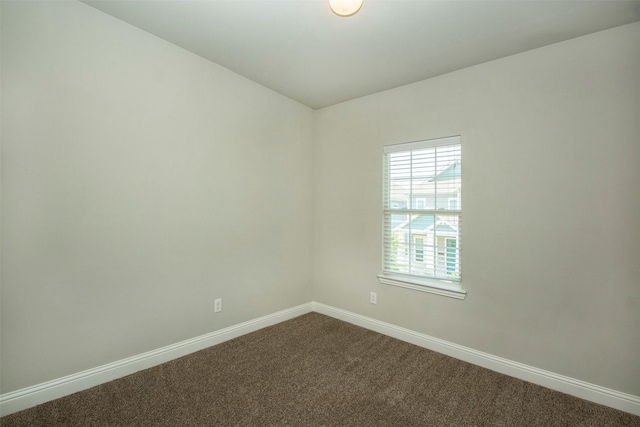 3613 Pisa Mews, Dallas, TX 75236 - empty room featuring baseboards and dark carpet