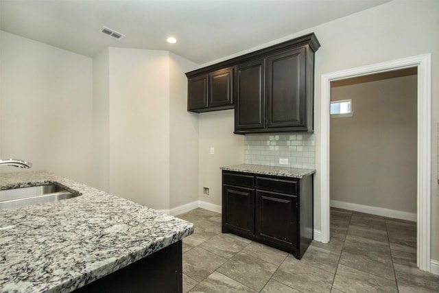 3613 Pisa Mews, Dallas, TX 75236 - kitchen featuring a sink, light stone countertops, baseboards, and recessed lighting