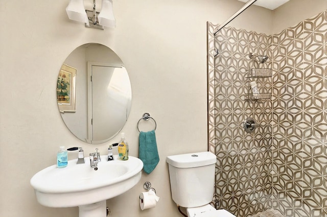 7109 Alpha Rd, Dallas, TX 75240 - full bath with tiled shower, toilet, and a sink