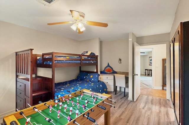 7109 Alpha Rd, Dallas, TX 75240 - bedroom featuring wood finished floors, baseboards, and a ceiling fan