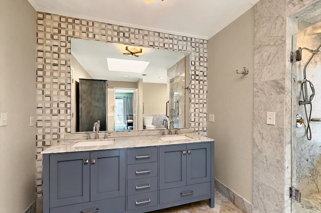 7109 Alpha Rd, Dallas, TX 75240 - full bathroom featuring a stall shower, double vanity, toilet, and a skylight