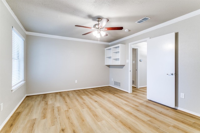 2 Linderhof Cir, Bedford, TX 76022 - unfurnished room featuring ornamental molding, light wood-type flooring, a ceiling fan, baseboards, and a textured ceiling