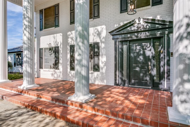 2 Linderhof Cir, Bedford, TX 76022 - doorway to property with brick siding and a porch