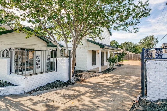 2 Linderhof Cir, Bedford, TX 76022 - view of side of home with brick siding and driveway