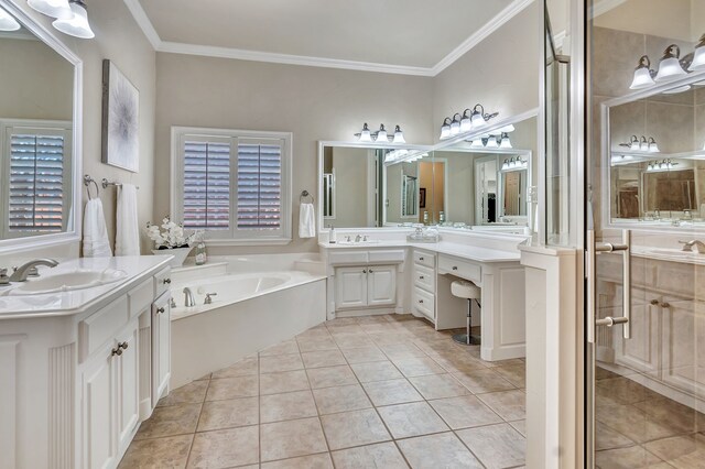 8304 Spence Dr, North Richland Hills, TX 76182 - bathroom featuring two vanities, a bath, tile patterned floors, and crown molding