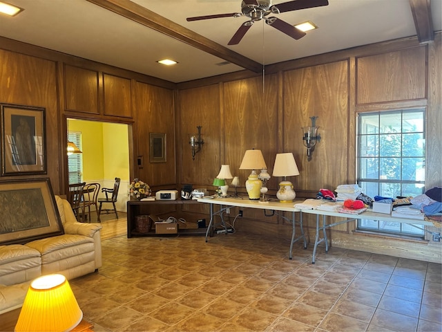 2317 Cliffside Dr, Plano, TX 75023 - living room with beamed ceiling, wood walls, ceiling fan, and tile patterned flooring