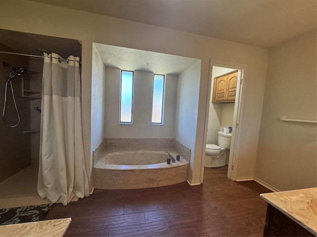 2317 Cliffside Dr, Plano, TX 75023 - bathroom featuring toilet, a bath, wood finished floors, and a shower with shower curtain
