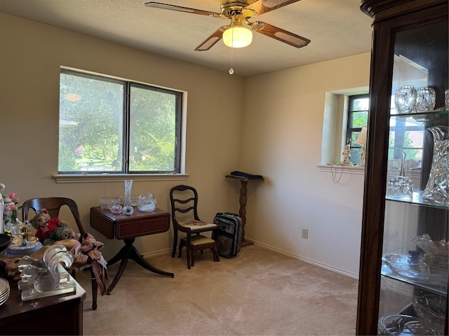2317 Cliffside Dr, Plano, TX 75023 - sitting room featuring healthy amount of natural light, ceiling fan, light colored carpet, and baseboards