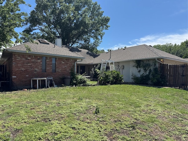 2317 Cliffside Dr, Plano, TX 75023 - rear view of house with a chimney, brick siding, and roof with shingles