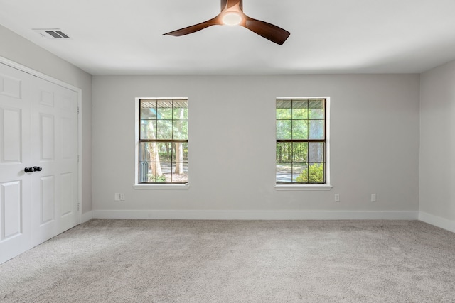 3562 Bent Oak St E, Greenville, TX 75401 - unfurnished bedroom with multiple windows, carpet floors, and baseboards
