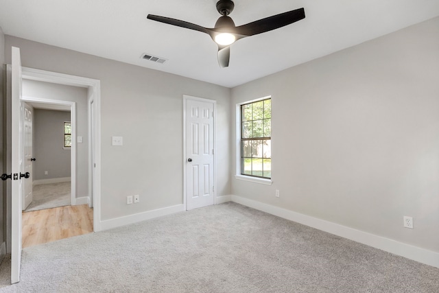 3562 Bent Oak St E, Greenville, TX 75401 - unfurnished bedroom with light carpet, baseboards, ceiling fan, and a closet