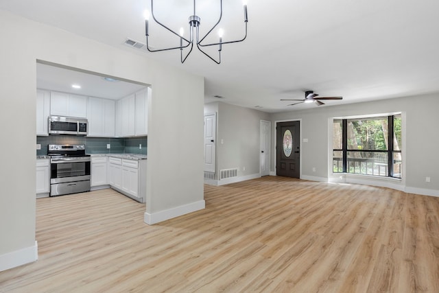 3562 Bent Oak St E, Greenville, TX 75401 - kitchen featuring stainless steel appliances, light wood-style flooring, decorative backsplash, and white cabinetry