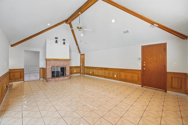1521 Treeline Dr, Desoto, TX 75115 - unfurnished living room with a wainscoted wall, beamed ceiling, ceiling fan, a brick fireplace, and high vaulted ceiling