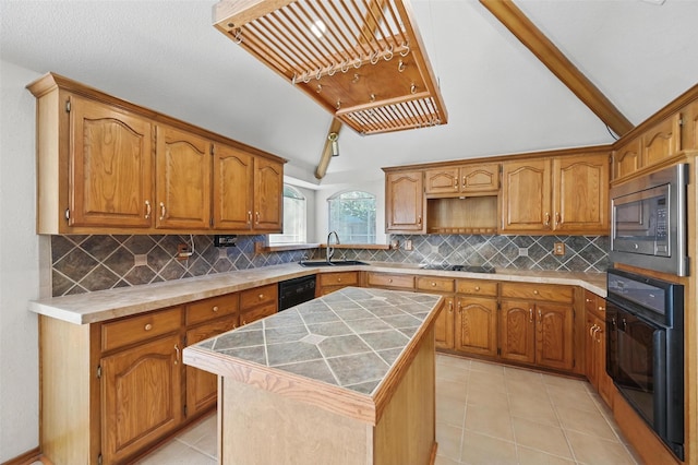 1521 Treeline Dr, Desoto, TX 75115 - kitchen featuring black appliances, a sink, a kitchen island, light tile patterned floors, and tasteful backsplash