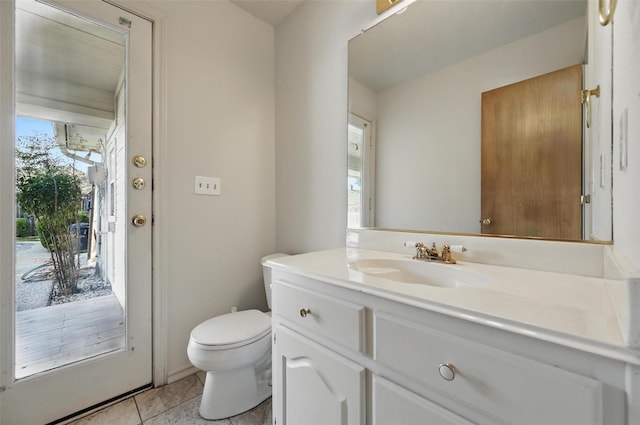 1521 Treeline Dr, Desoto, TX 75115 - bathroom with toilet, vanity, and tile patterned floors