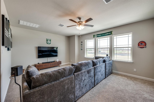 1824 Rachel St, Northlake, TX 76247 - living room featuring ceiling fan, carpet, baseboards, and a textured ceiling