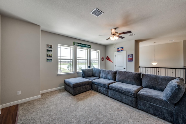 1824 Rachel St, Northlake, TX 76247 - living room featuring ceiling fan, carpet, baseboards, and a textured ceiling