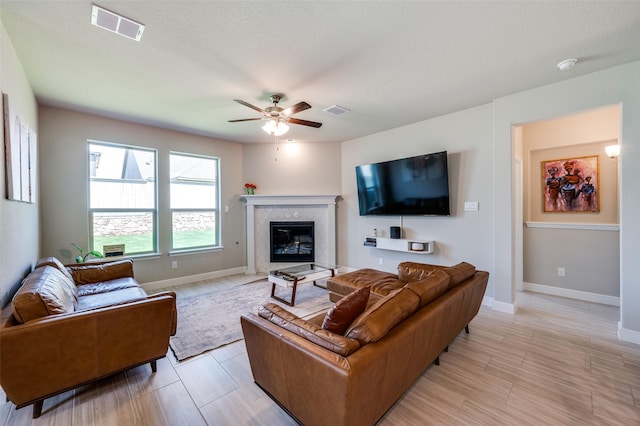 1824 Rachel St, Northlake, TX 76247 - living room featuring ceiling fan, a fireplace, and baseboards